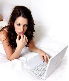Julia Allison at her laptop